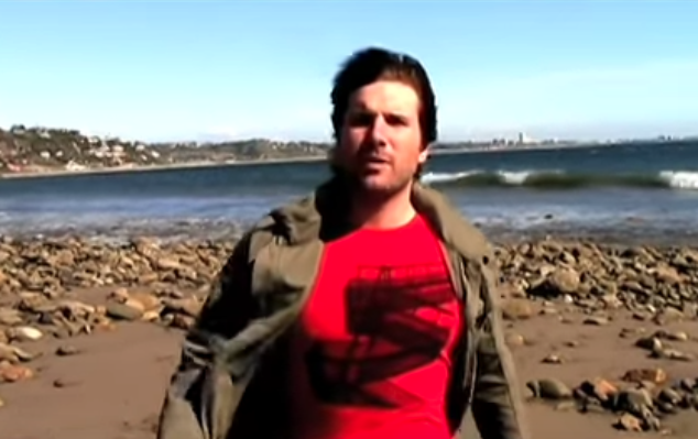 A still from the youtube video where Jon walks on the beach
